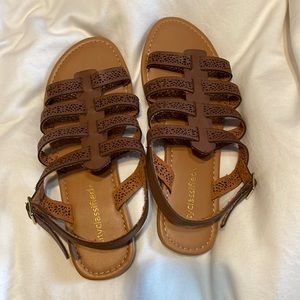 NWOT Brown man made leather sandals.